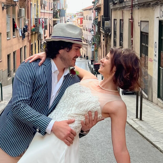 Groom dipping bride on the streets of Madrid